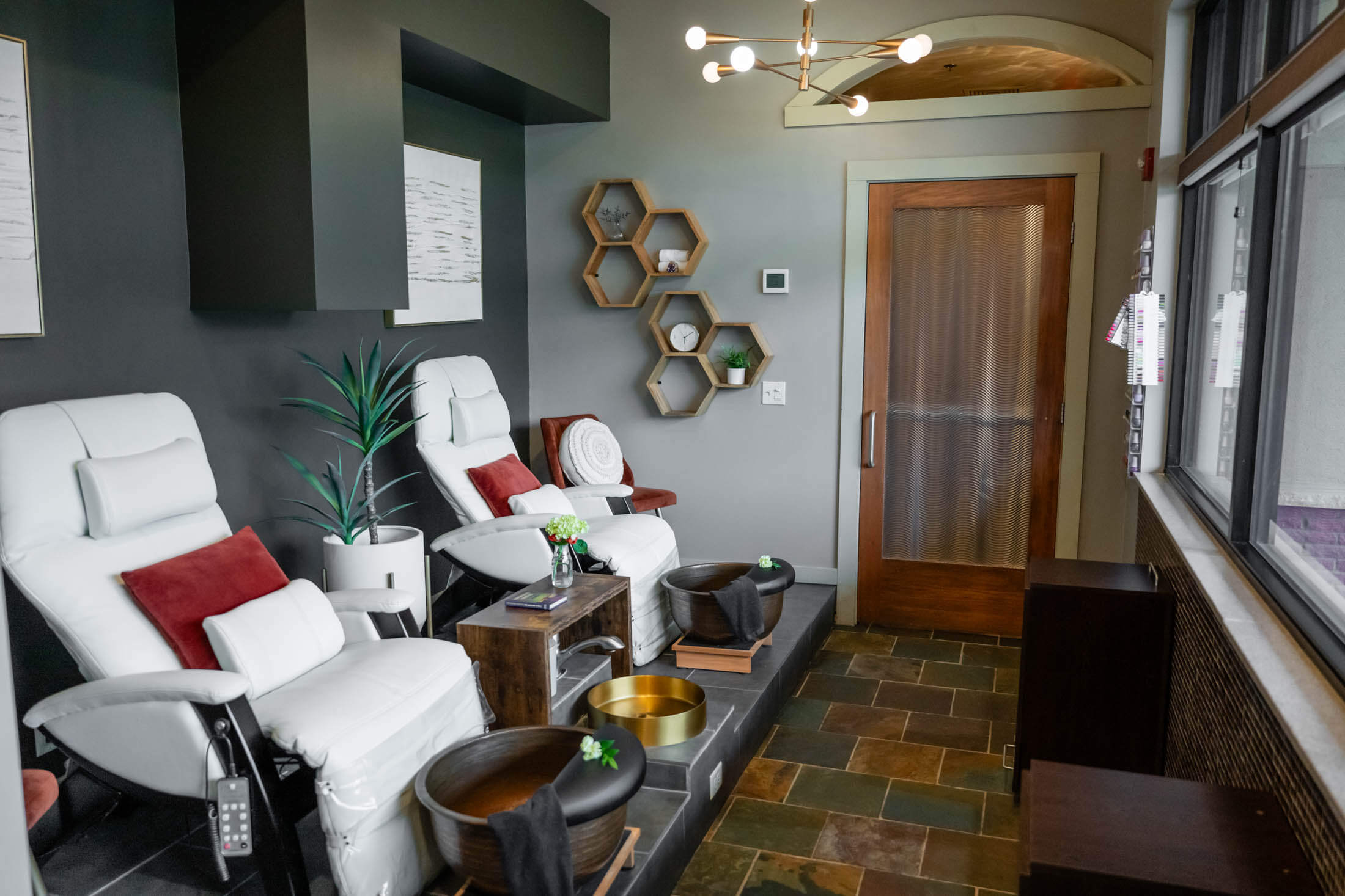 Spa room with comfortable chairs and decor.