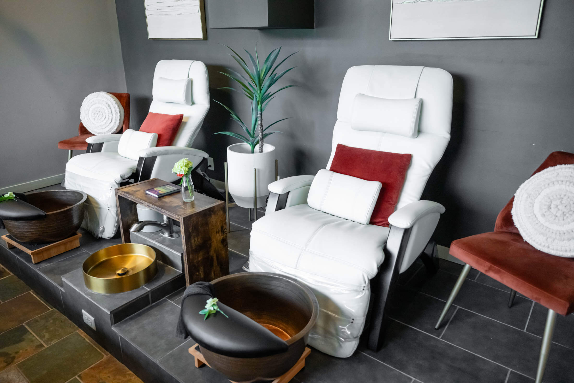 Spa pedicure chairs with foot baths.