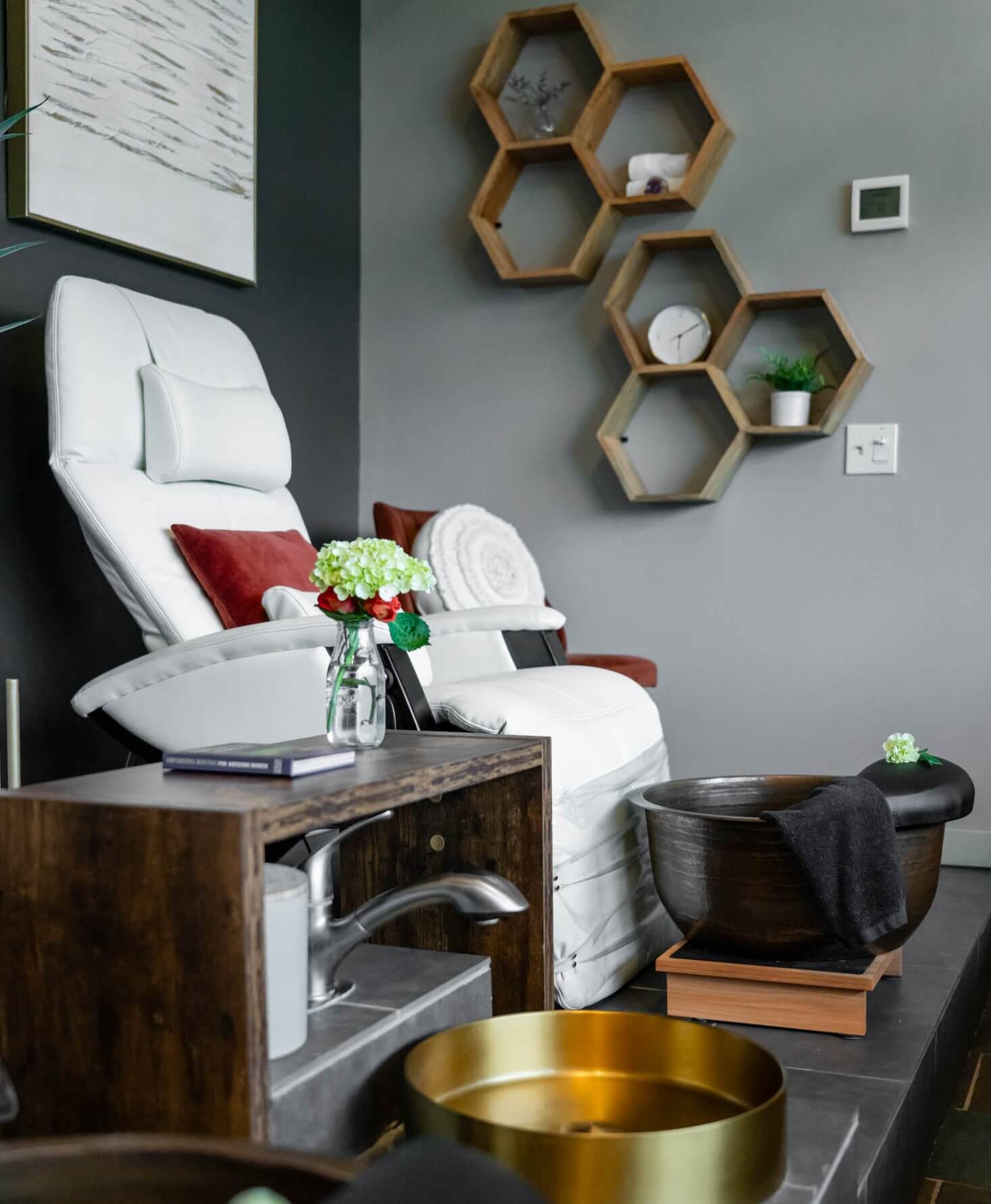 Modern spa room with massage chair.