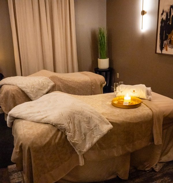 Spa room with two massage tables.