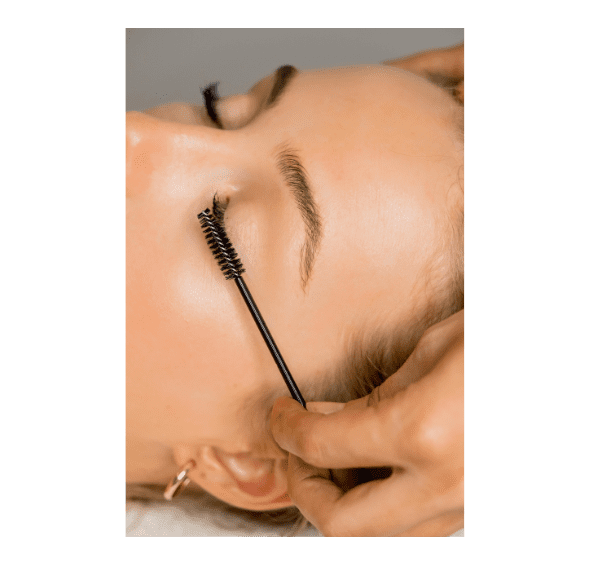 Applying mascara on closed eye lashes.