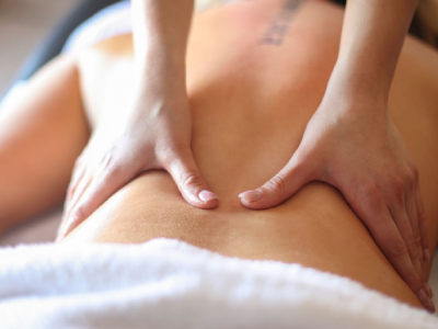 Back massage with hands applying pressure.