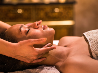 Woman receiving a relaxing facial massage.